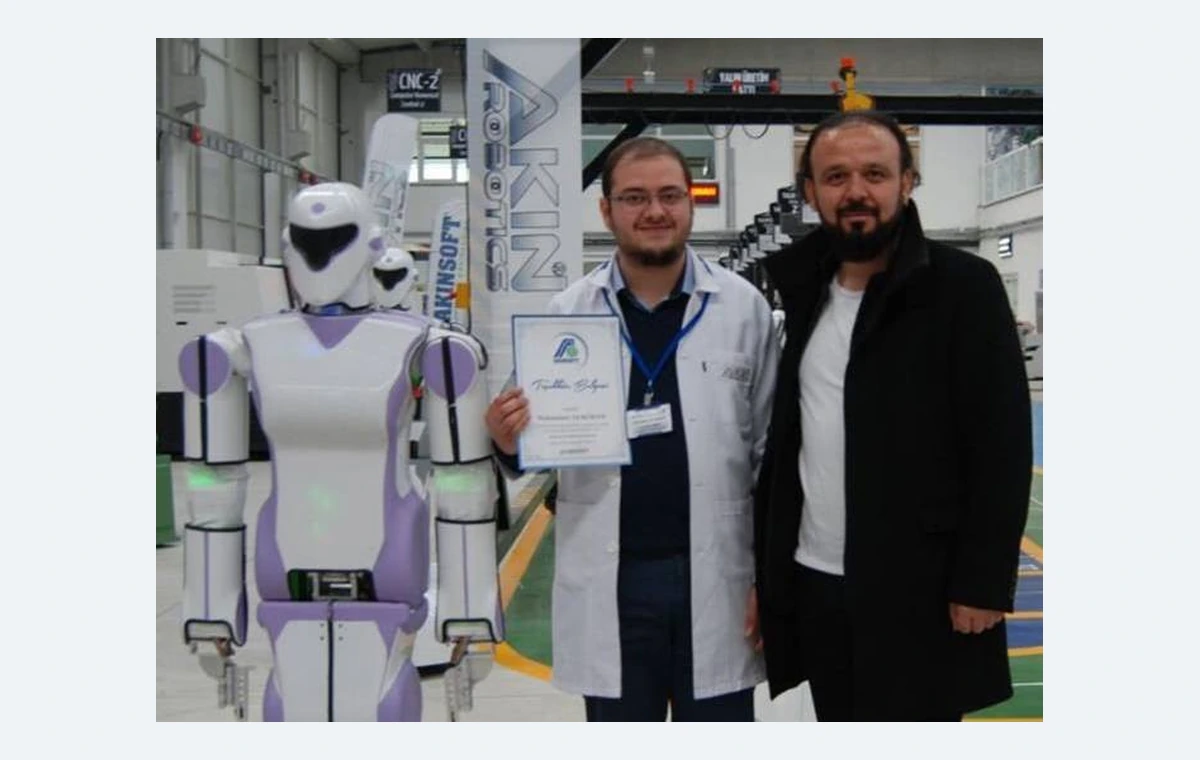 Photograph with robots at AKINROBOTICS in 2017